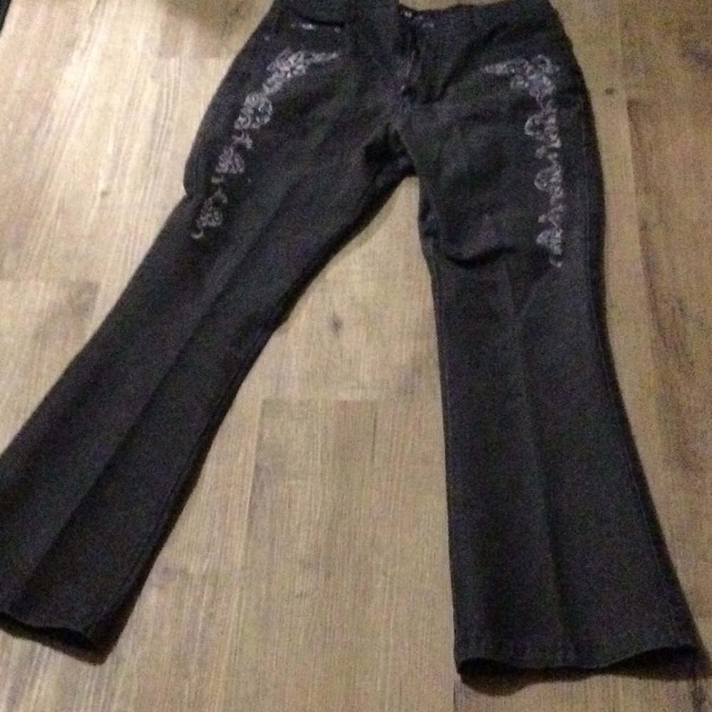 Revolt jeans size 16 side has decorative trim.